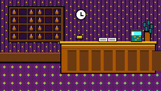 The front desk: a board of keys, a clock, a bell, the register and a tips jar
